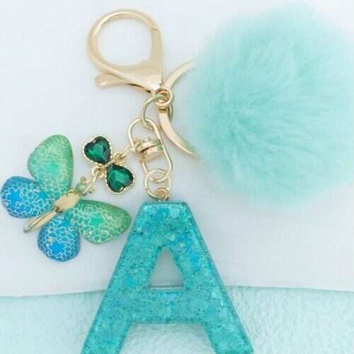 Initial Keychain With Snowflake Resin Pendant and Fur Ball